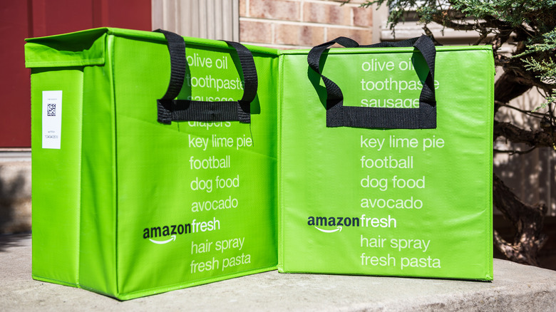 Green Amazon Fresh bags on doorstep