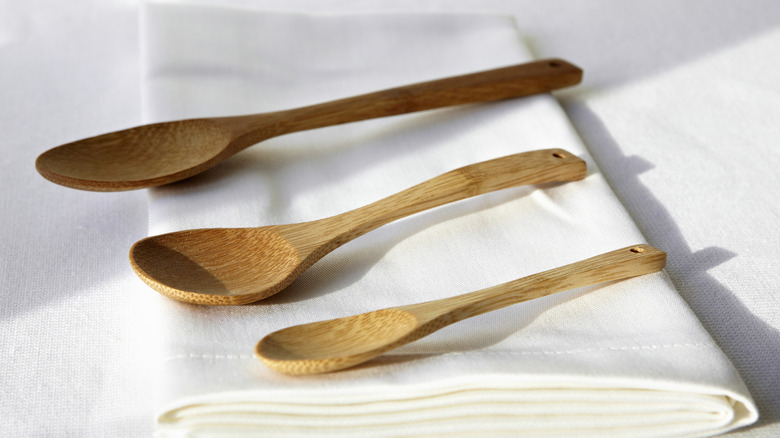 Wooden utensils on a cloth napkin