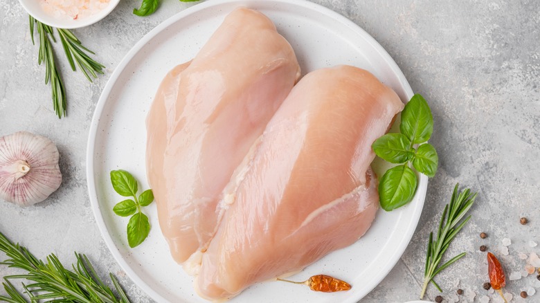 raw chicken breast on display