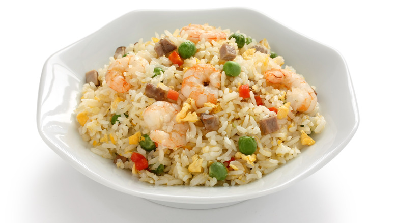 bowl of fried rice with shrimp and veggies