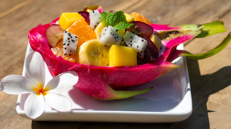Fruit salad in dragon fruit shell 