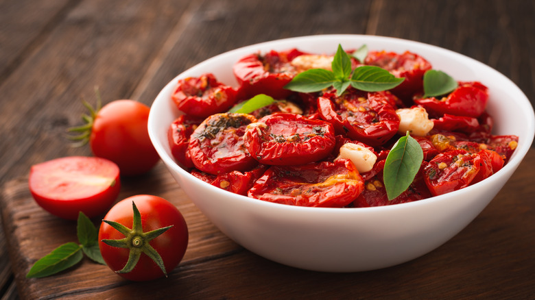 A white bowl of sun-dried tomatoes