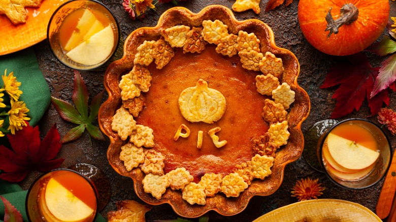 pumpkin pie with pie crust decorations on top