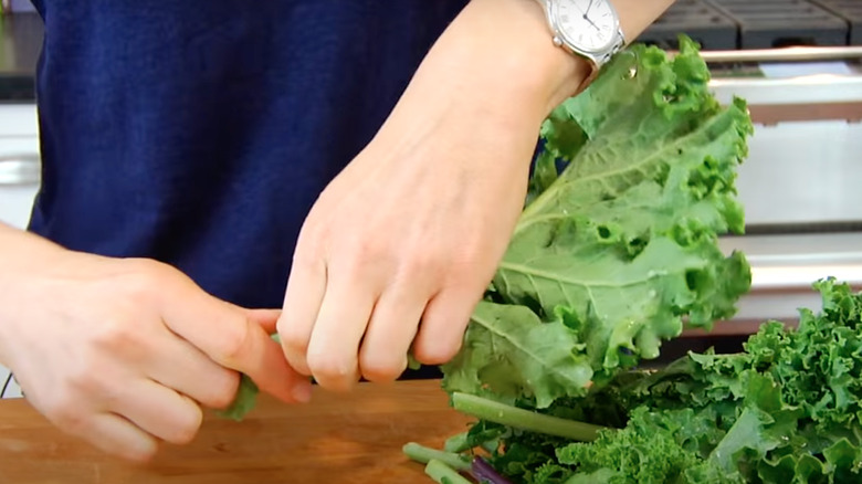 Destemming kale by hand