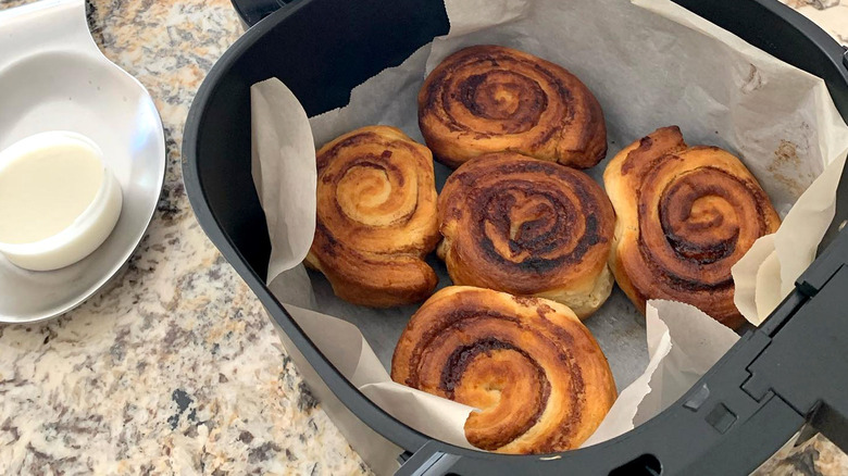 Cinnamon rolls in air fryer basket