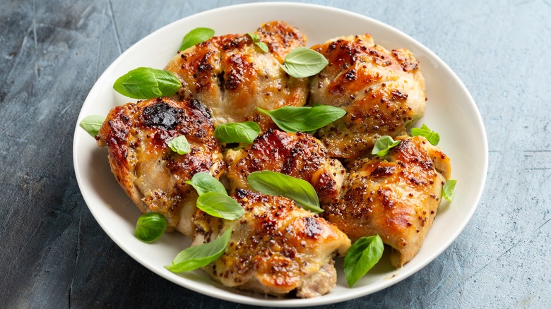 Honey mustard chicken thighs with fresh basil