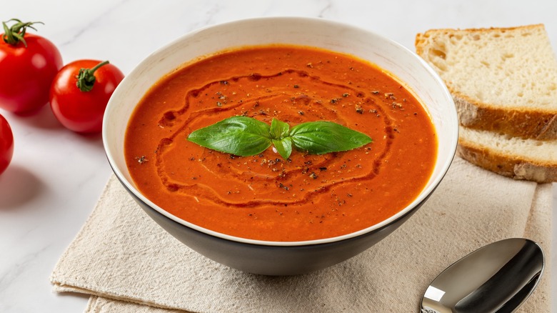 Bowl of tomato soup drizzled with oil