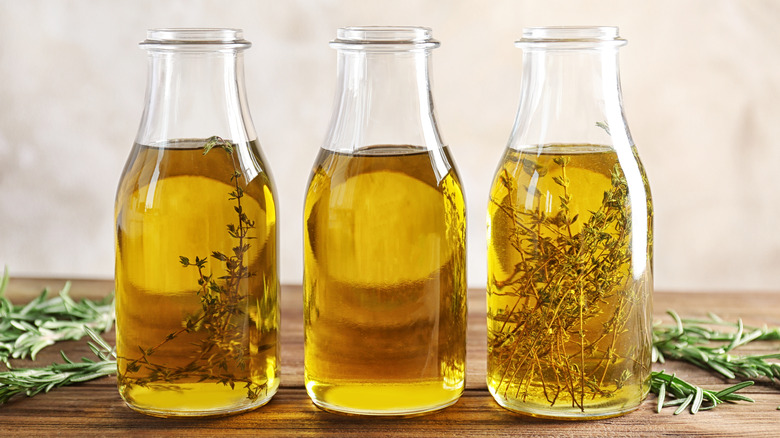 Bottles of olive oil infused with herbs