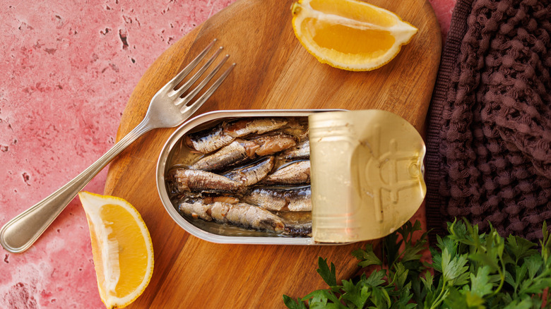 tinned fish with lemon wedges