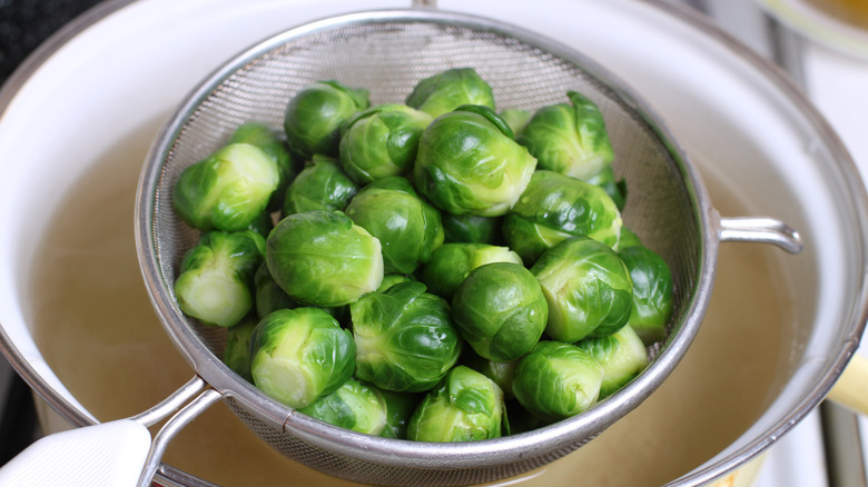 Colander with blanched Brussels sprouts