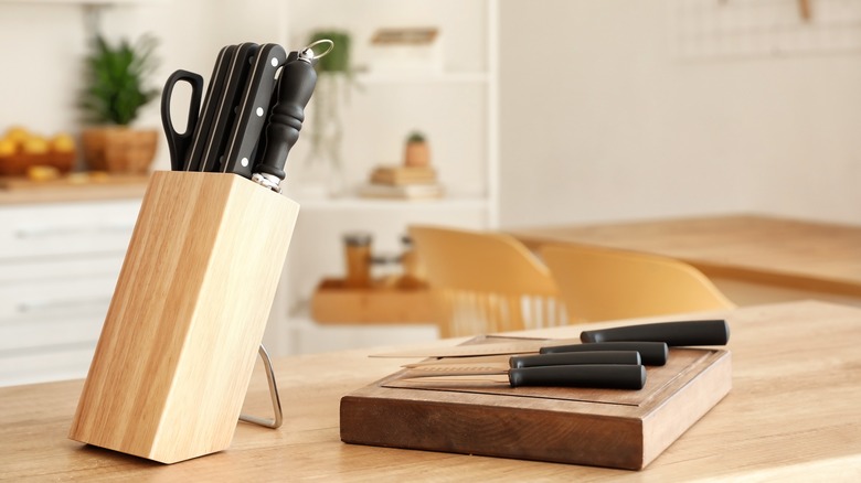 Knife set in wood block with cutting board