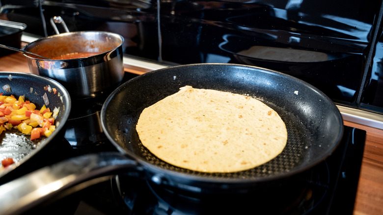 tortilla in a skillet on a stove top