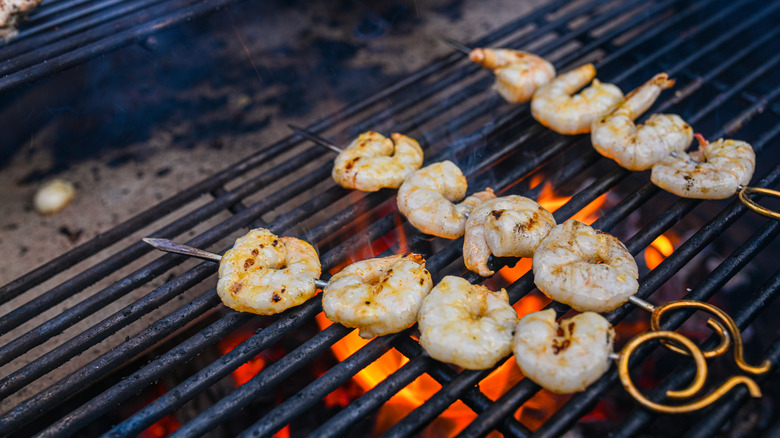 Shrimps on skewers on the grill