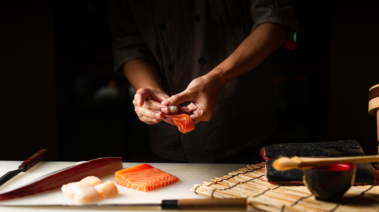 Sushi chef preparing nigiri