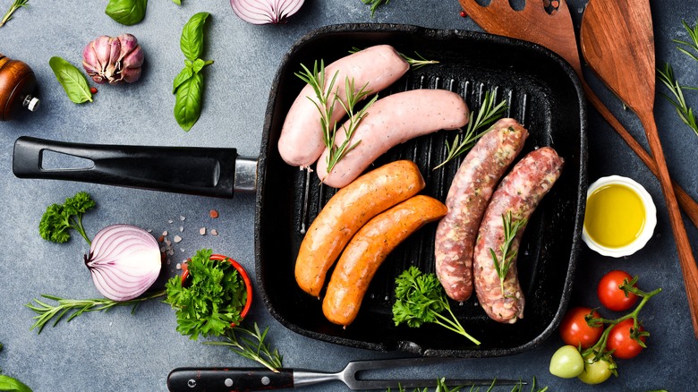 Raw sausages in a grill pan