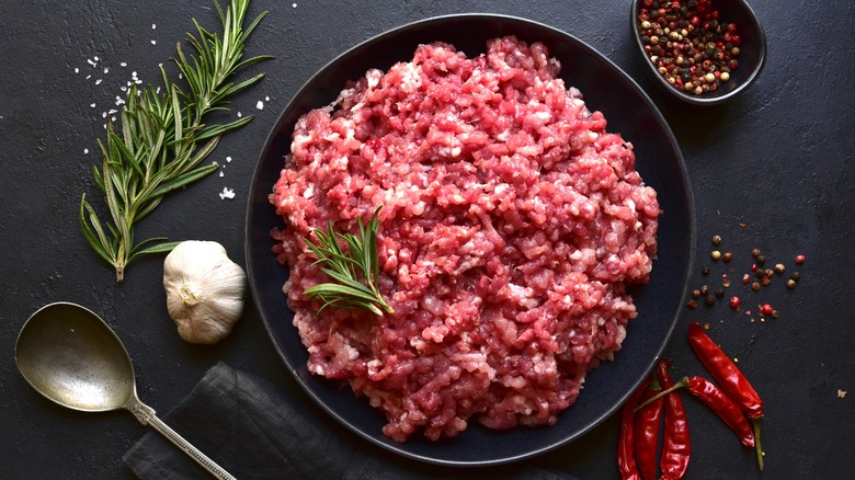 Bowl of homemade minced meat in black bowl