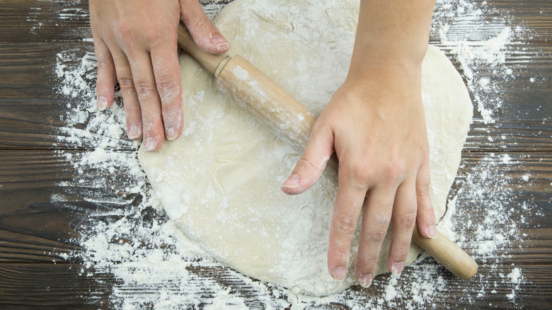 making pasta dough with a rolling pin