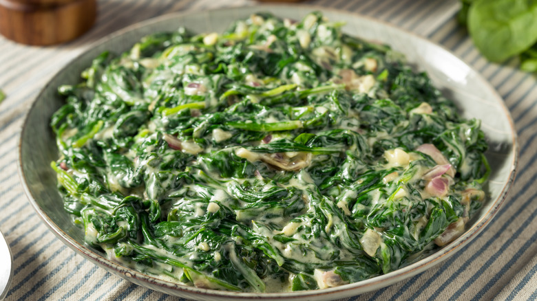 Creamed spinach with garlic and onions in a bowl