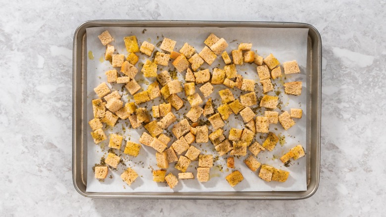 A baking tray with croutons