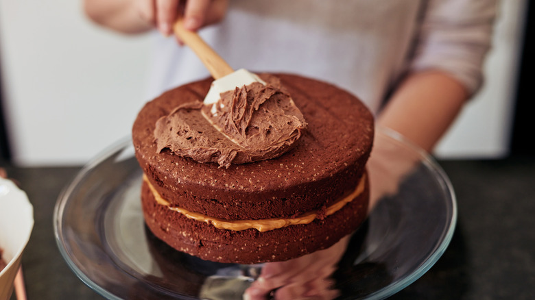 frosting a homemade cake