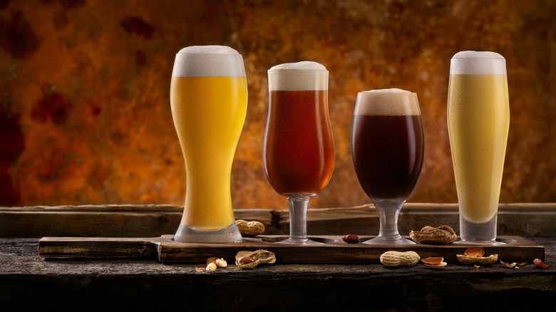 Selection of beers on table with peanuts