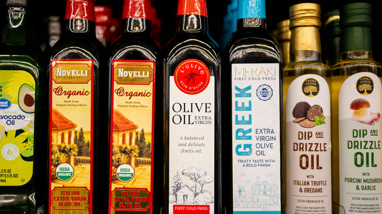 bottles of olive oil on shelf