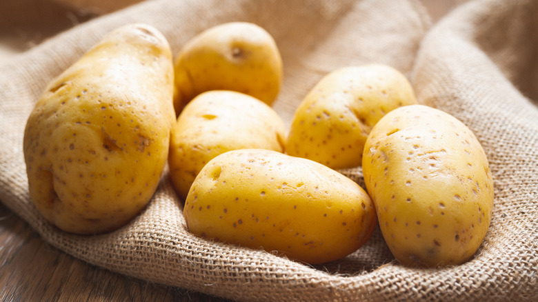 yukon gold potatoes resting on cloth