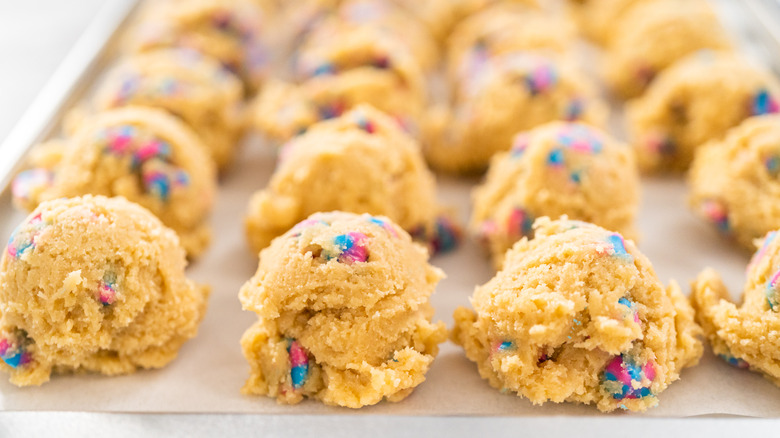 Scoops of cookie dough on baking sheet