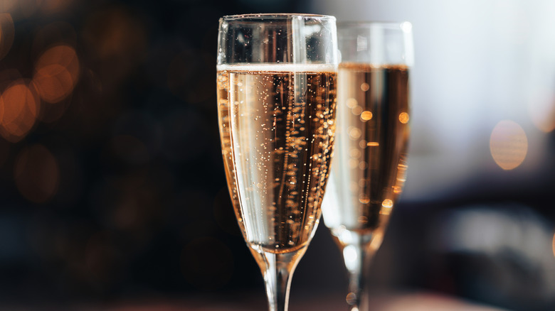 Close up shot of two Champagne flutes full of sparkling wine