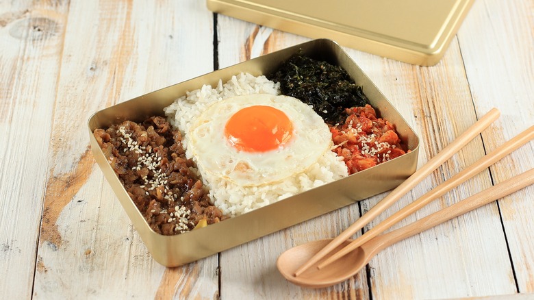 dosirak lunchbox with rice, meat, egg, and kimchi