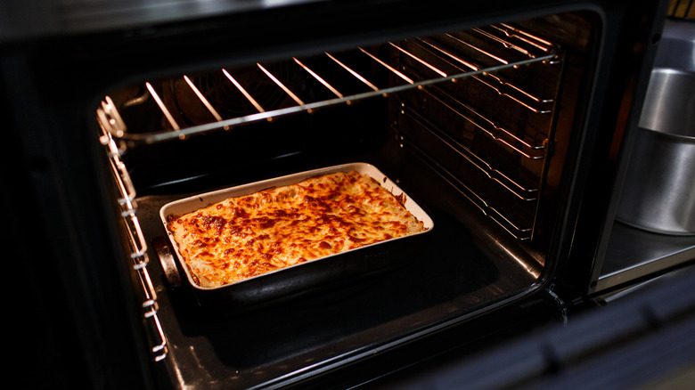 lasagna cooking in the oven