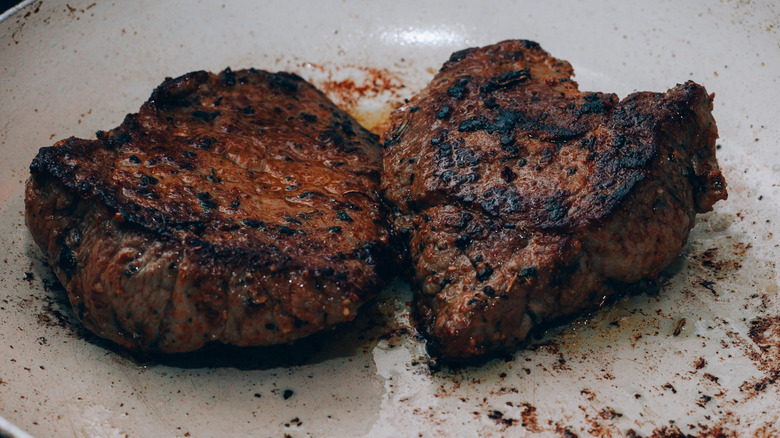 Overcooked meat in a pan