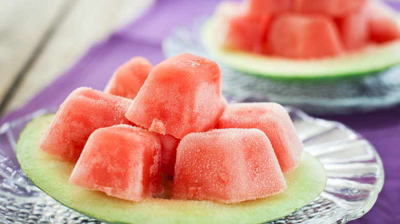 Watermelon ice cubes on a plate