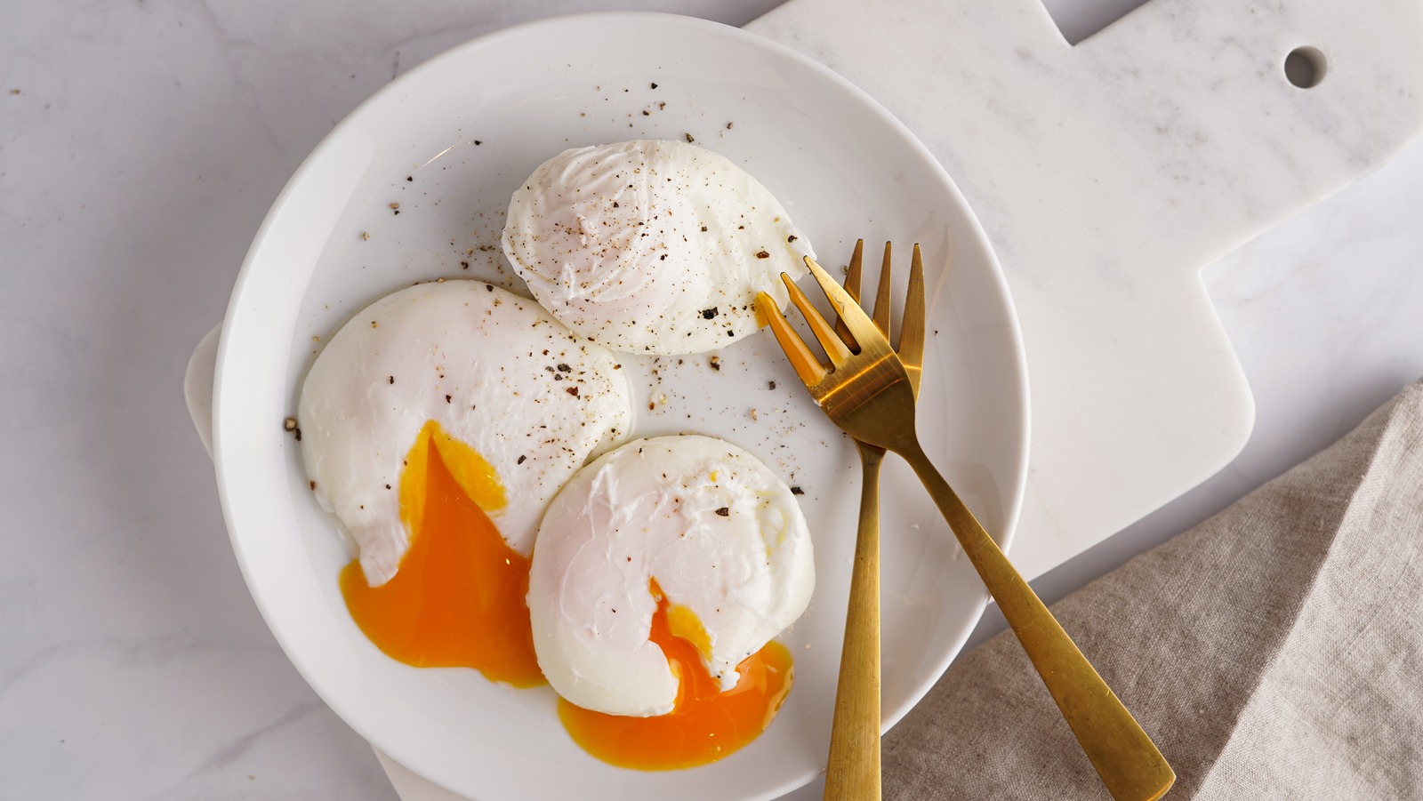 https://www.foodrepublic.com/img/gallery/how-to-save-and-reheat-a-big-batch-of-poached-eggs/l-intro-1692747272.jpg