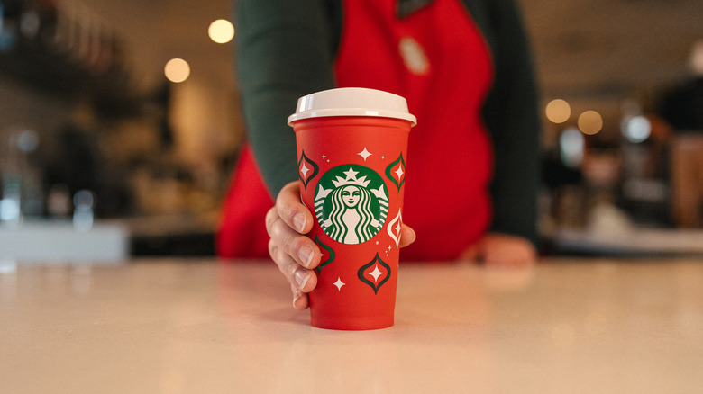 https://www.foodrepublic.com/img/gallery/how-to-score-a-free-starbucks-red-reusable-holiday-cup/intro-1700065484.jpg
