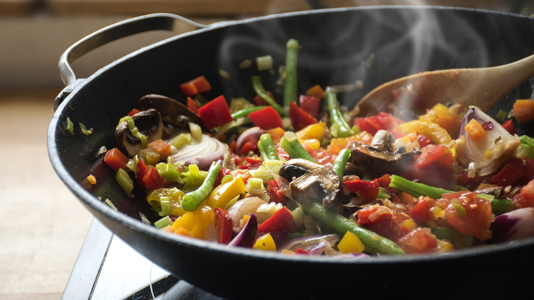 vegetables cooking in hot wok