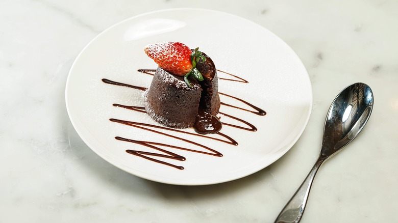 Chocolate lava cake with strawberry on plate