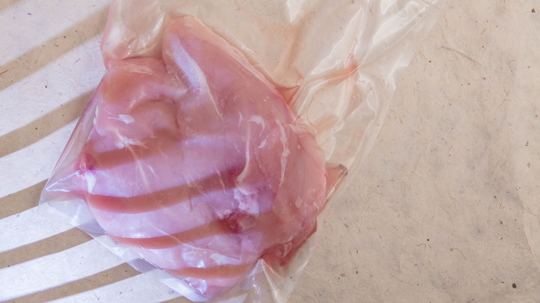 Chicken filets packed in plastic bags for sous vide cooking