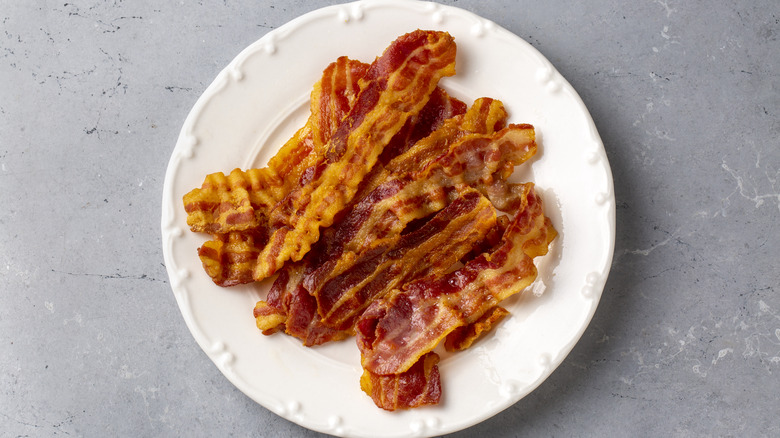 crispy bacon sitting on a plate