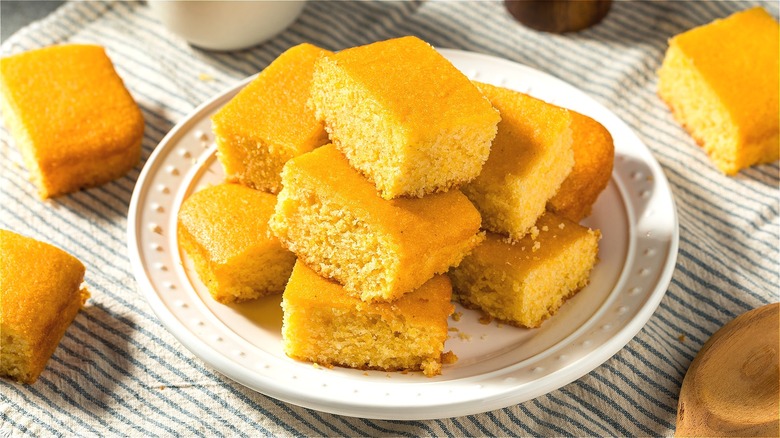 Pieces of cornbread stacked on plate