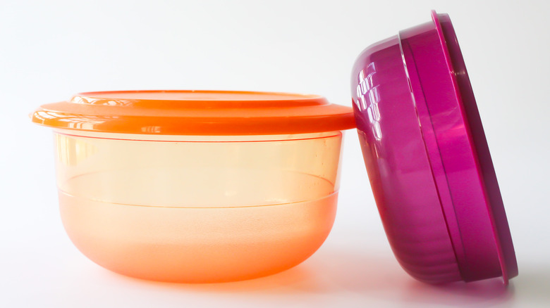 Two empty plastic tupperware containers 