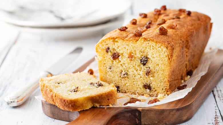 Fruit cake made with raisins on a wooden board