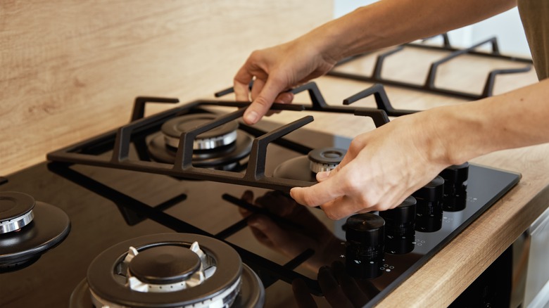 assembling the stovetop after cleaning