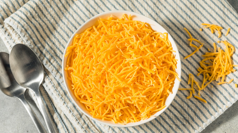 a bowl of shredded cheese