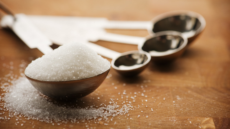 Tablespoon filled with white sugar