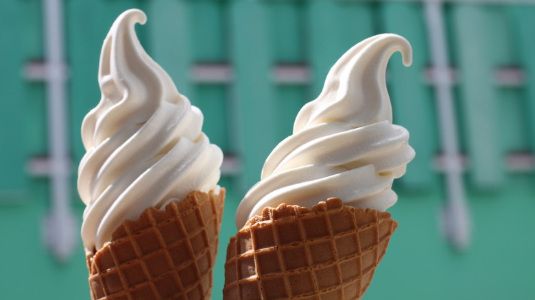 Person being handed soft serve from truck