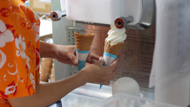 Person using soft serve machine