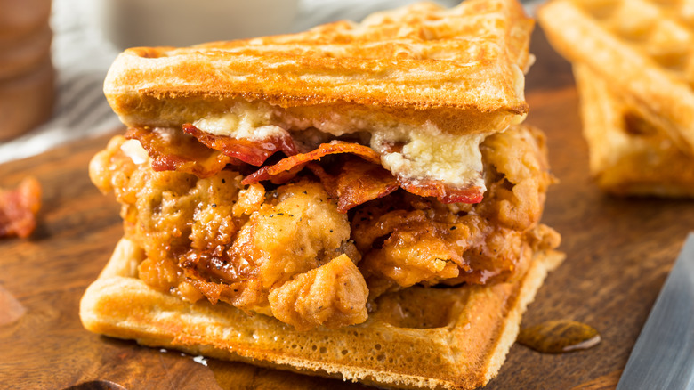 Chicken and waffles sandwich with bacon and cheese