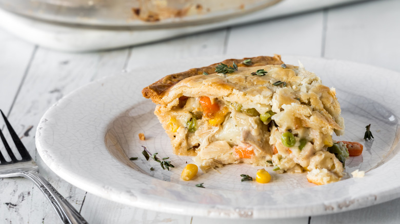 Slice of turkey pot pie on a white plate