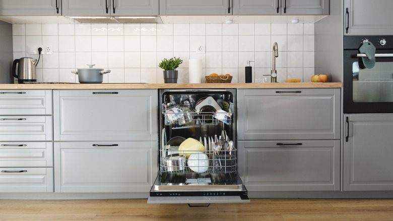 A full dishwasher in a kitchen